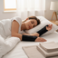 Person sleeping while wearing wrist supports